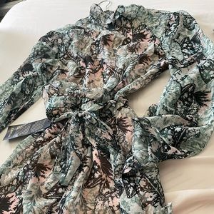 Open green back Bell Sleeve romper from BEBE